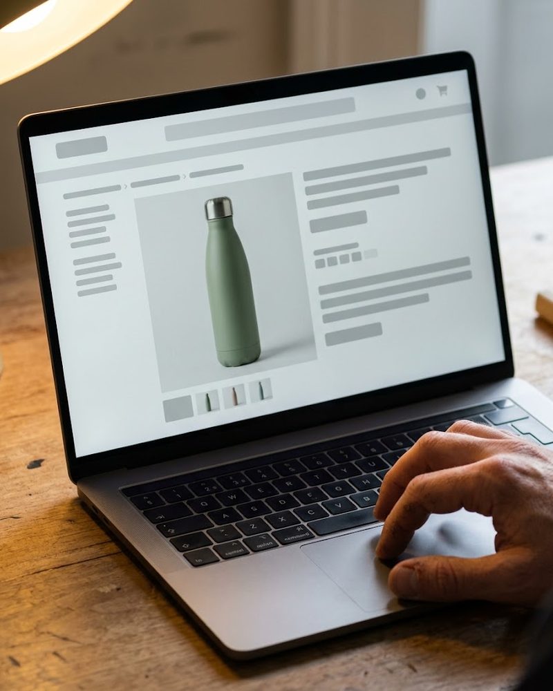 Online listing of insulated bottles viewed on a laptop